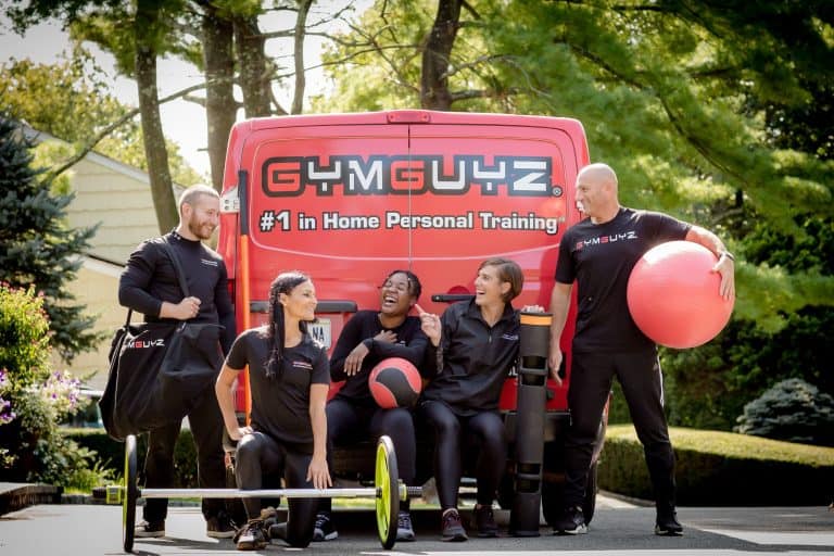 GYMGUYZ Launches Cutting-Edge GG DRIVE Platform to Enhance Franchisee Success GymGuyz Vehicle and team - franchise news