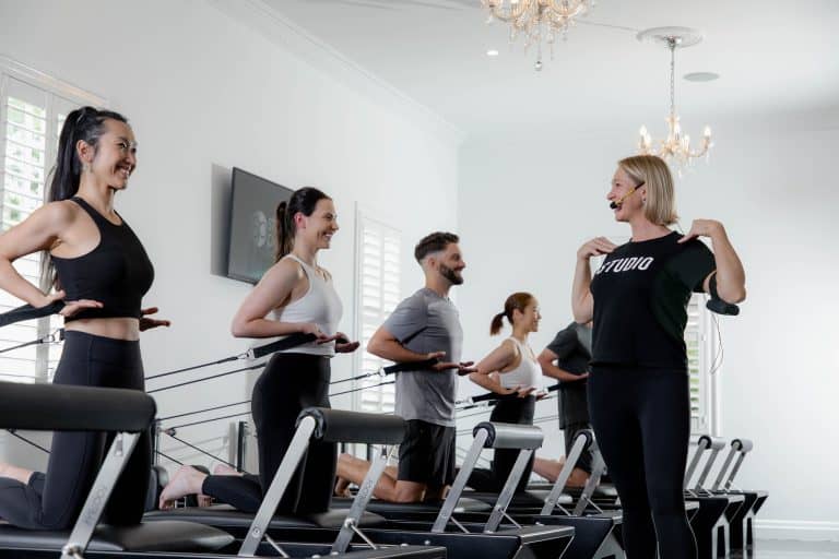Studio Pilates International: Stretching Footprint, Growing Revenue, Strengthening Core Image of Studio Pilates Franchise Interior and Instructor