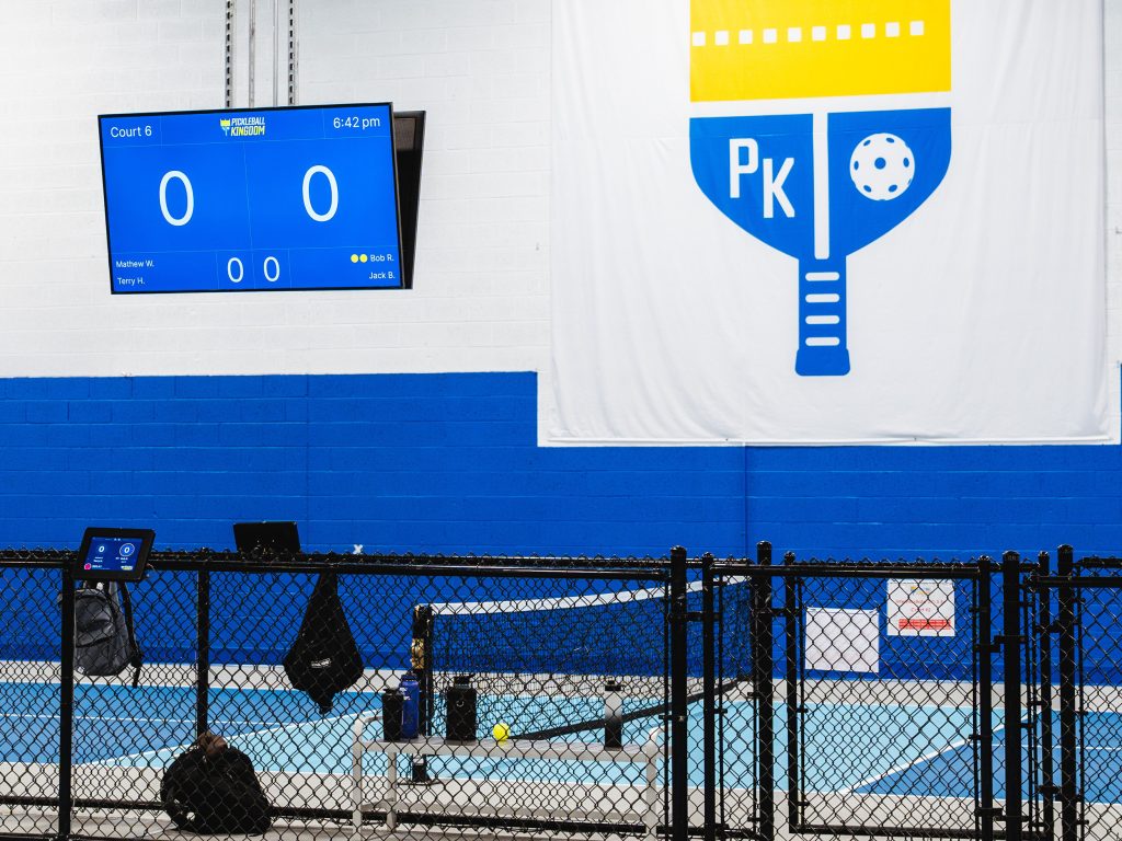 Image of pickleball court and score board for franchise technology article. 