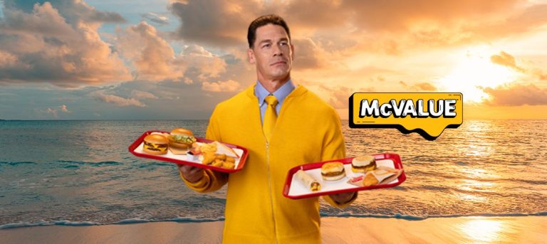 McDonald’s and John Cena Team Up to Deliver a Smackdown on High Prices with New McValue Menu John Cena in yellow sweater holding McValue Menu