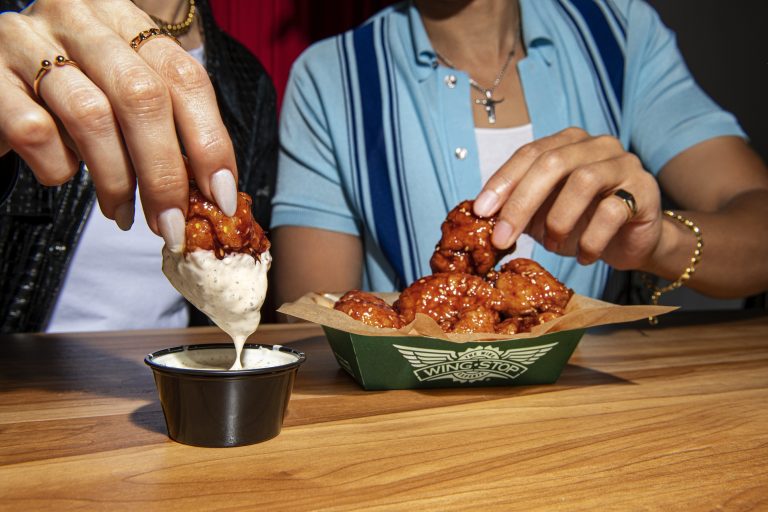 Image of first ever wingstop ranch bottle. Clear bottle, green wrap in green box