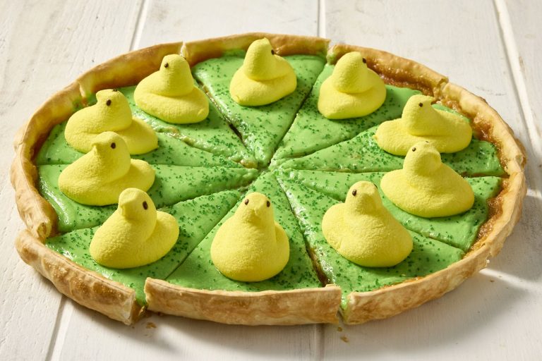 Pizza Inn Peeps Pizzert. Dessert pizza with of green hue with yellow peeps candy on top.