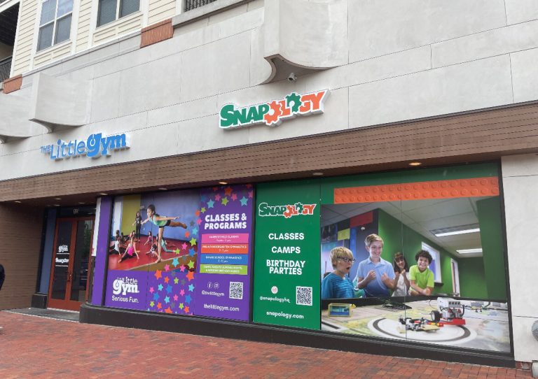 A store front with a sign that says "snap day".