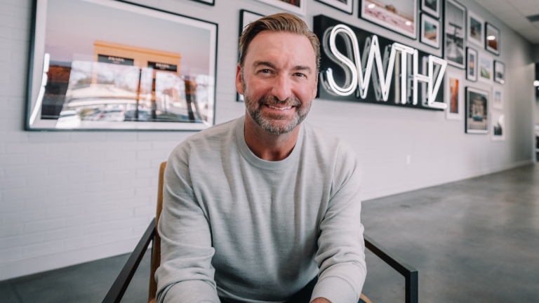 Image of Jamie Weeks in a chair at a creative studio