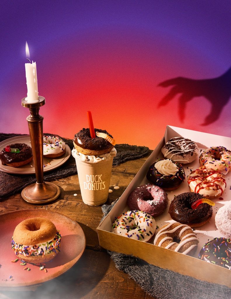 Duck Donuts Spooky Dozen featuring Halloween-inspired donuts with gummy worms, sprinkles, and buttercream, part of October donut trends and seasonal franchise menu strategy.