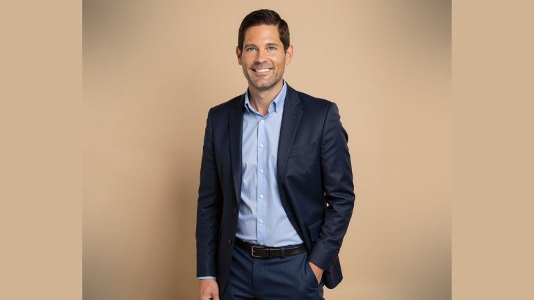 Erik Jensen, new vice president of marketing at BRIX Holdings, smiles in a navy suit.