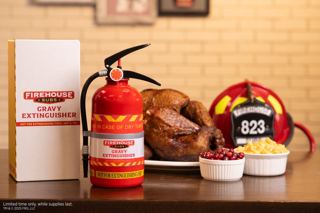 Firehouse Subs “Gravy Extinguisher” beside a roast turkey with cranberries and mac and cheese on a table