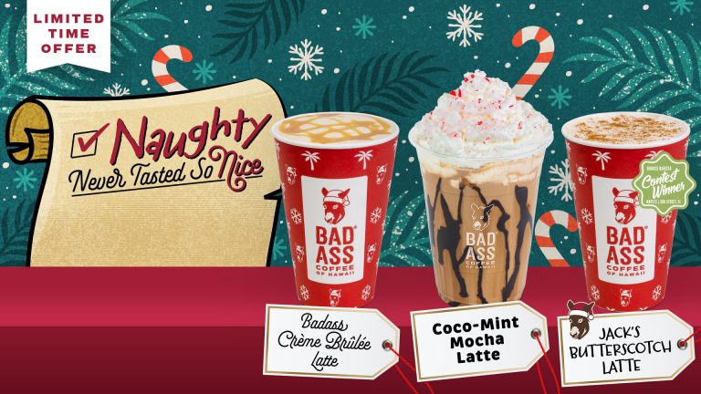 Three holiday lattes from Bad Ass Coffee of Hawaii displayed in festive cups