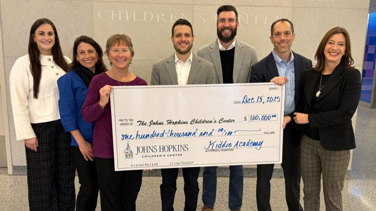 Group presenting a $100,000 Kiddie Academy check at Johns Hopkins Children’s Center