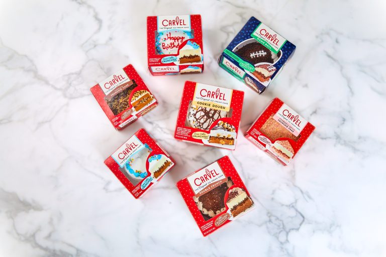 Carvel Ice Cream Cakes with updated red packaging displayed on marble surface