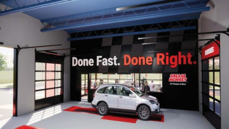 Rising Costs Push Franchise Brands to Sell an Experience, Not Just a Service Technician speaks with a customer at an automotive service center about maintenance recommendations