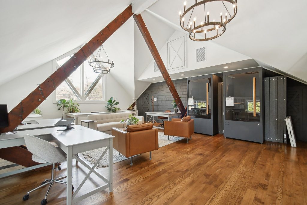 Workspace at a Haven center with desks, lounge seating, and private booths