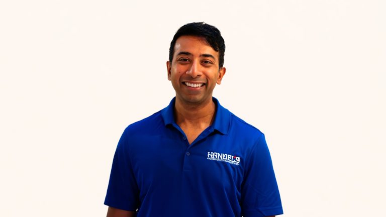 Naveen Dasa in Handel’s Ice Cream polo smiling at camera