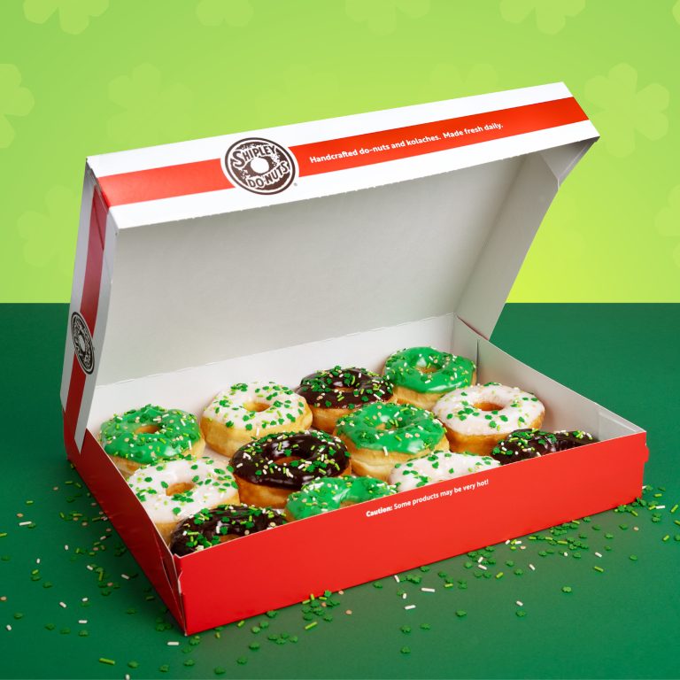Open Shipley Donuts box filled with green, white, and chocolate St. Patrick’s Day donuts