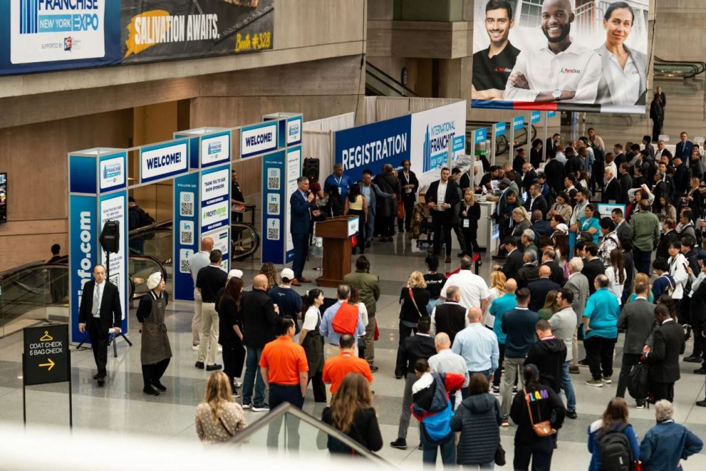 Attendees gather near registration during the 2025 International Franchise Expo in New York City