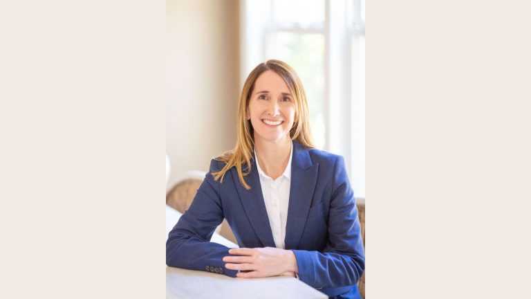 Trona Balkissoon, Golden Corral CFO, smiling in a professional office setting
