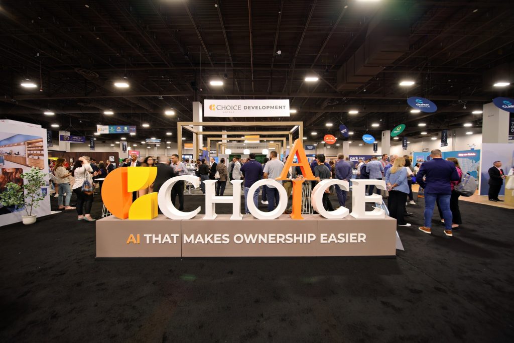 Choice Hotels convention expo floor with attendees and brand displays