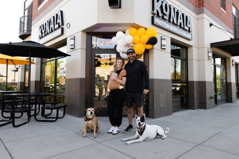 Konala founders Trace and Jammie Miller with their baby and rescue dogs Kona and Nala at a grand opening