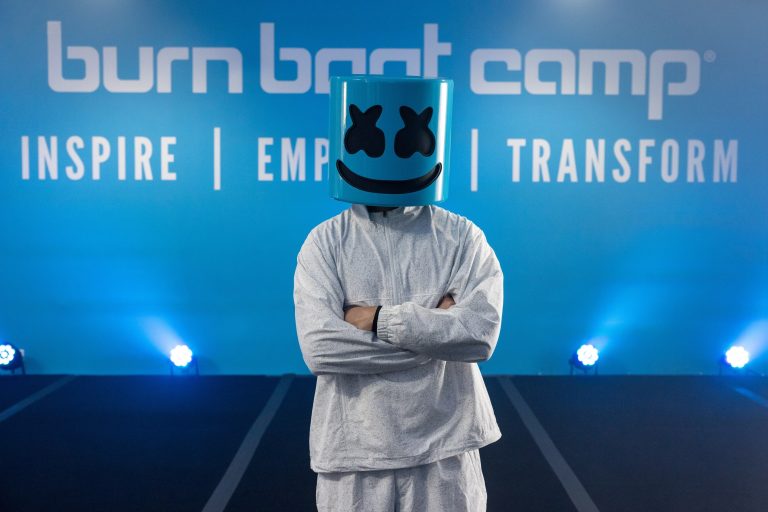 Marshmello poses at Burn Boot Camp partnership event