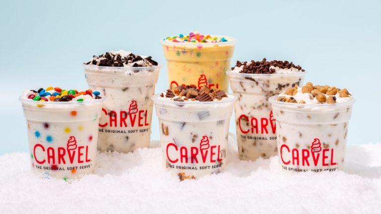 Assorted Carvelanche soft serve treats topped with candy, cookies, and Carvel Crunchies