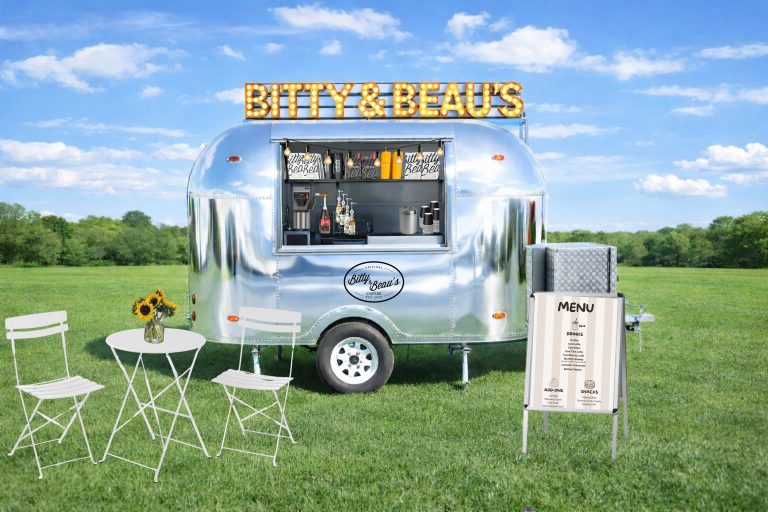 Bitty & Beau’s Coffee Mini Cruiser mobile coffee trailer in a grassy outdoor setting