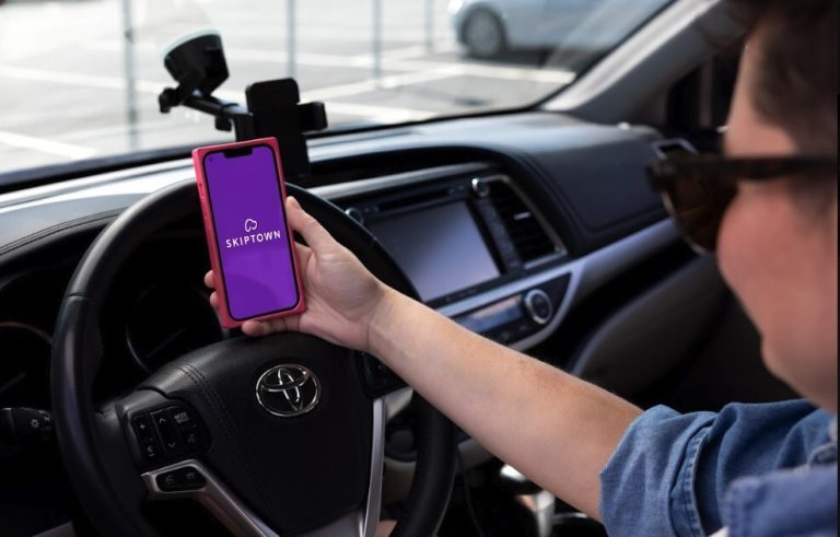 Skiptown app used inside a car for dog care pickup and drop-off