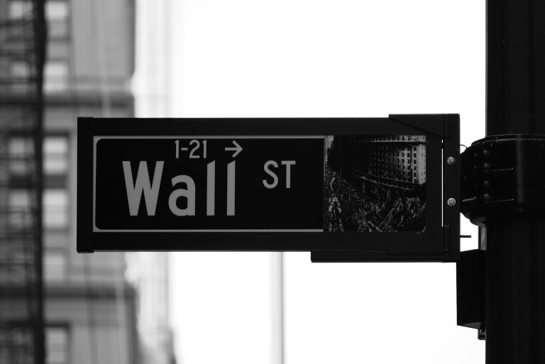 How Will Private Equity Impact the Future of Franchising? Black and white Wall Street sign in Lower Manhattan, symbolizing private equity's role in franchising