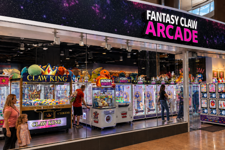 Fantasy Claw Arcade storefront at the Fashion Show Mall in Las Vegas with claw machines and guests visible through glass