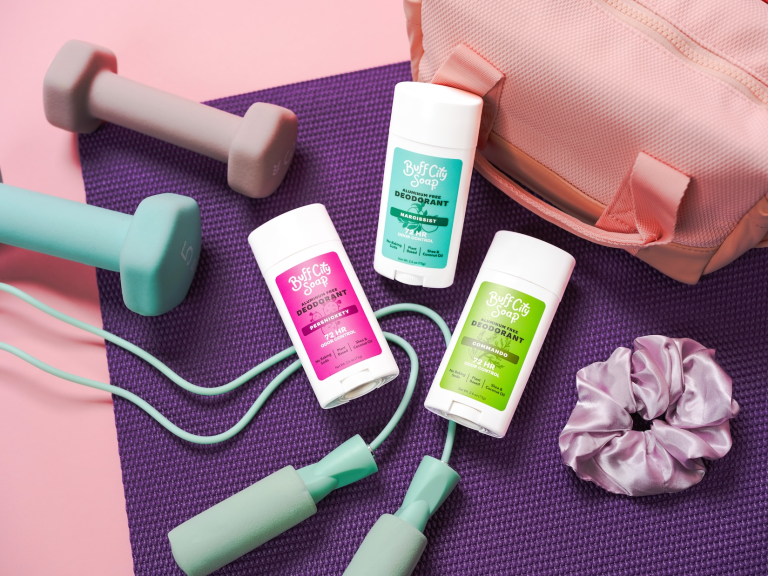Buff City Soap Launches Aluminum-Free Deodorant With 72-Hour Odor Control Buff City Soap aluminum-free deodorants displayed with fitness accessories and gym gear.