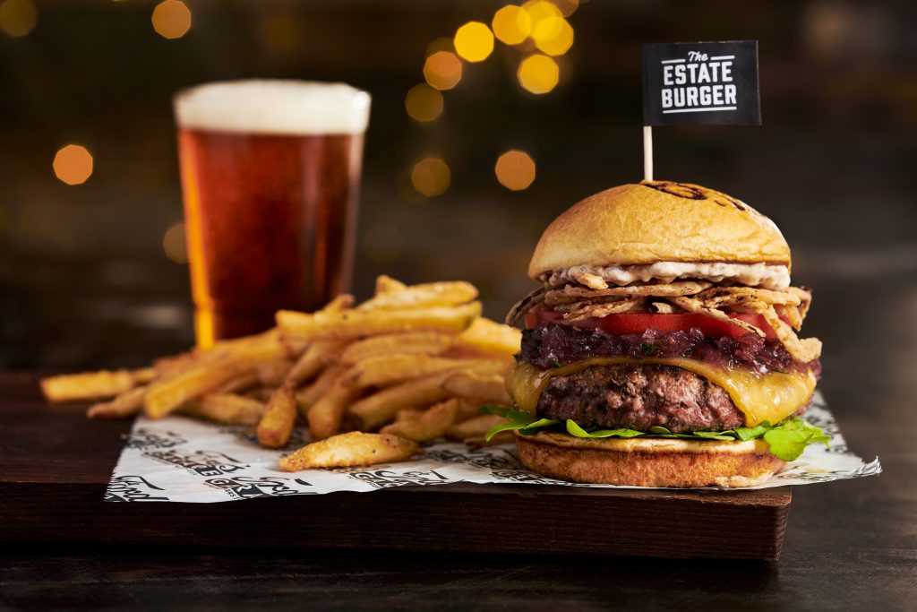 Ford's Garage Estate Burger with fries and a craft beer