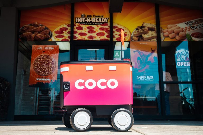 Little Caesars and Coco Robotics Bring Autonomous Pizza Delivery to More U.S. Cities Coco autonomous delivery robot parked outside a Little Caesars restaurant