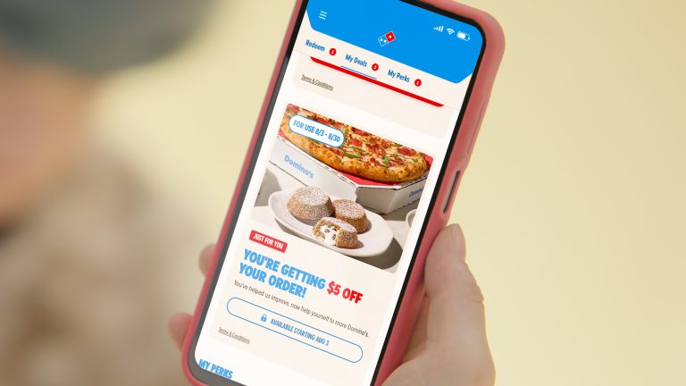 Domino’s app displays a $5 off reward for customers testing its redesigned digital ordering experience