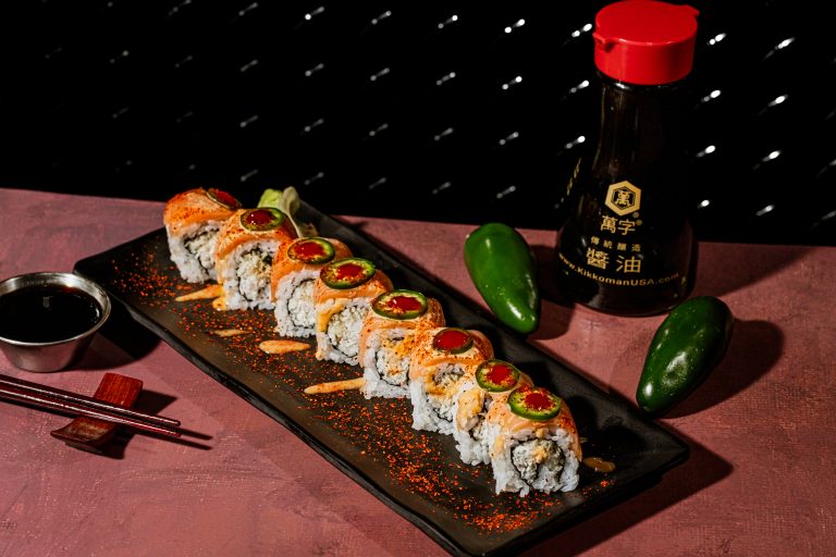 Rock N Roll Sushi Firecracker Roll with smoked salmon, jalapeño and spicy toppings