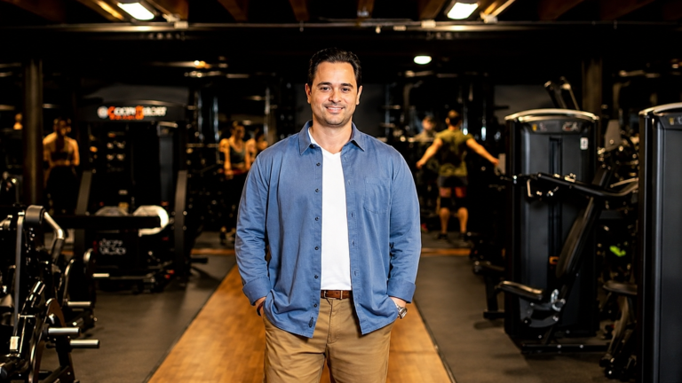 Peter Stipher, new Workout Anytime COO, standing inside a Workout Anytime fitness center