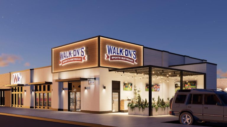 Walk-On’s Sports Bistreaux exterior rendering with illuminated signage and a covered patio